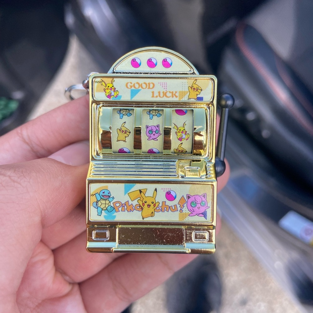 Gold Machine Keychain with Pikachu Design